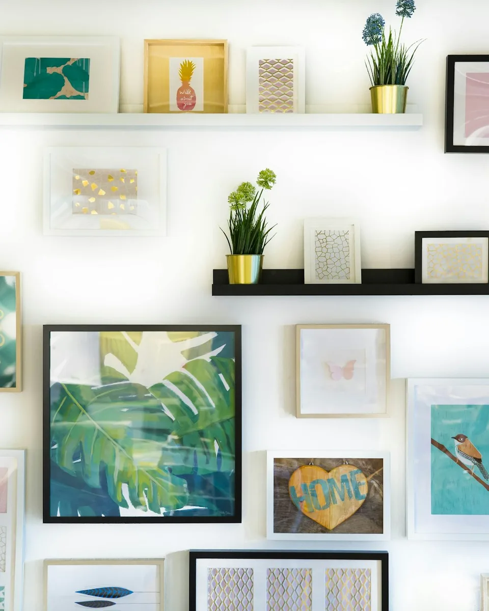 The gallery wall in the studio — prints and frames by our makers