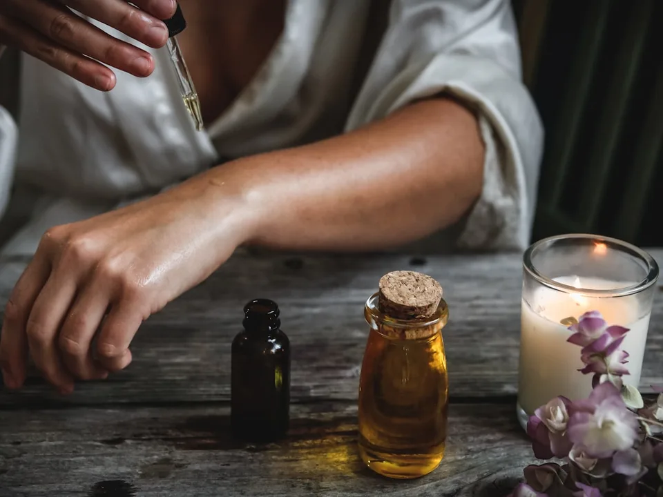 A maker filling a small batch by hand