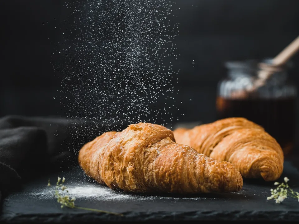 Fresh croissants stacked on the counter
