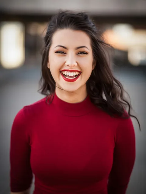 Portrait of a woman smiling softly toward the light